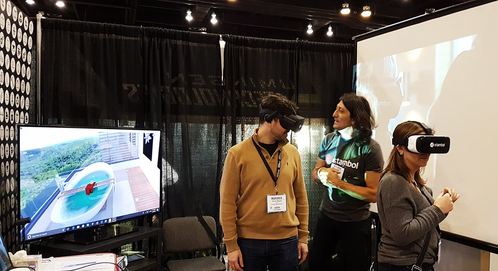 Couple of visitors are trying virtual reality at BuildEx Vancouver