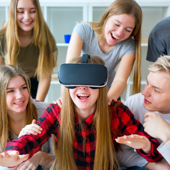 Group of friends playing with VR