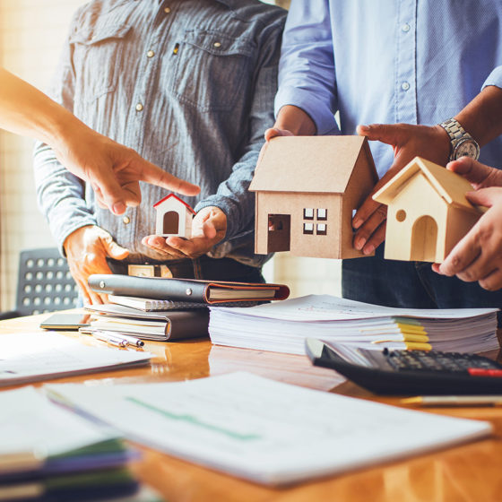real estate developers in a meeting discussing over model houses
