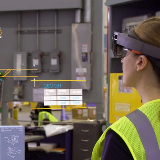 female employee wearing microsoft hololens in a warehouse