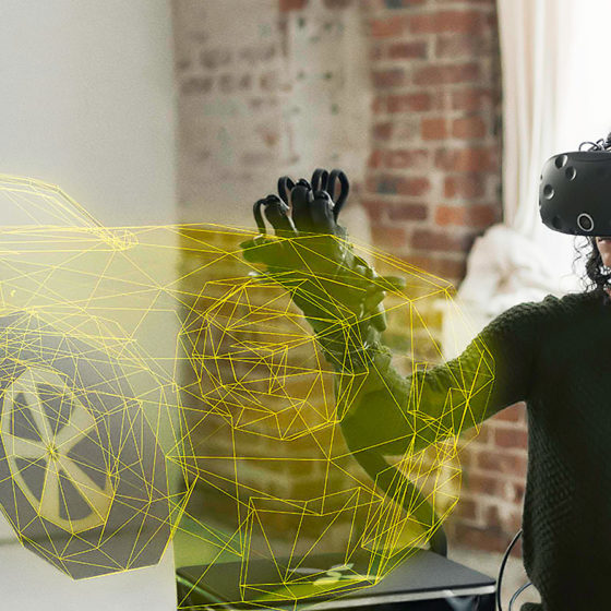 a female engineer is trying HaptX gloves and looking at virtual car design