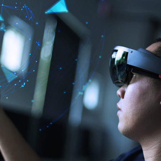 man wearing hololens and playing with a virtual object