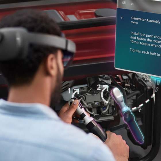 worker using HoloLens 2 in Microsoft Dynamics Guides mixed reality training application for enterprise