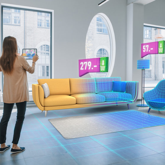 young couple using augmented reality shopping experience for furniture