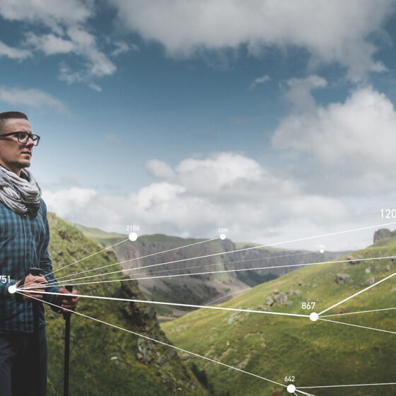 hiker using augmented reality glasses to explore outdoors and nature
